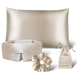 The Sensual Sleep Bundle - Dusty Gold by drowsysleepco features a beige silk pillowcase, sleep mask, scrunchie, and a matching drawstring pouch, all elegantly arranged on a white background.