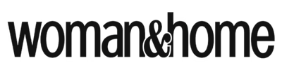 The image shows the woman&home logo in bold, black lowercase letters with an ampersand connecting the two words. The background is transparent.