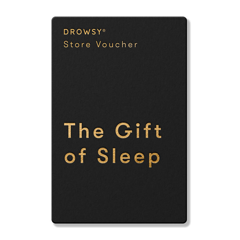 A black rectangular Sleep Gift Card with gold text reading "DROWSY Store Voucher" at the top and "The Gift of Sleep" in large letters—perfect for redeeming sleep essentials from our online store.