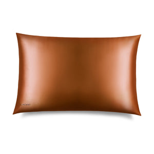 The Pumpkin Spice Silk Pillowcase, in a shiny bronze hue, is displayed on a white background with a “DROWSY” logo in the corner—an essential for skincare and beauty, perfect for protecting your hair.