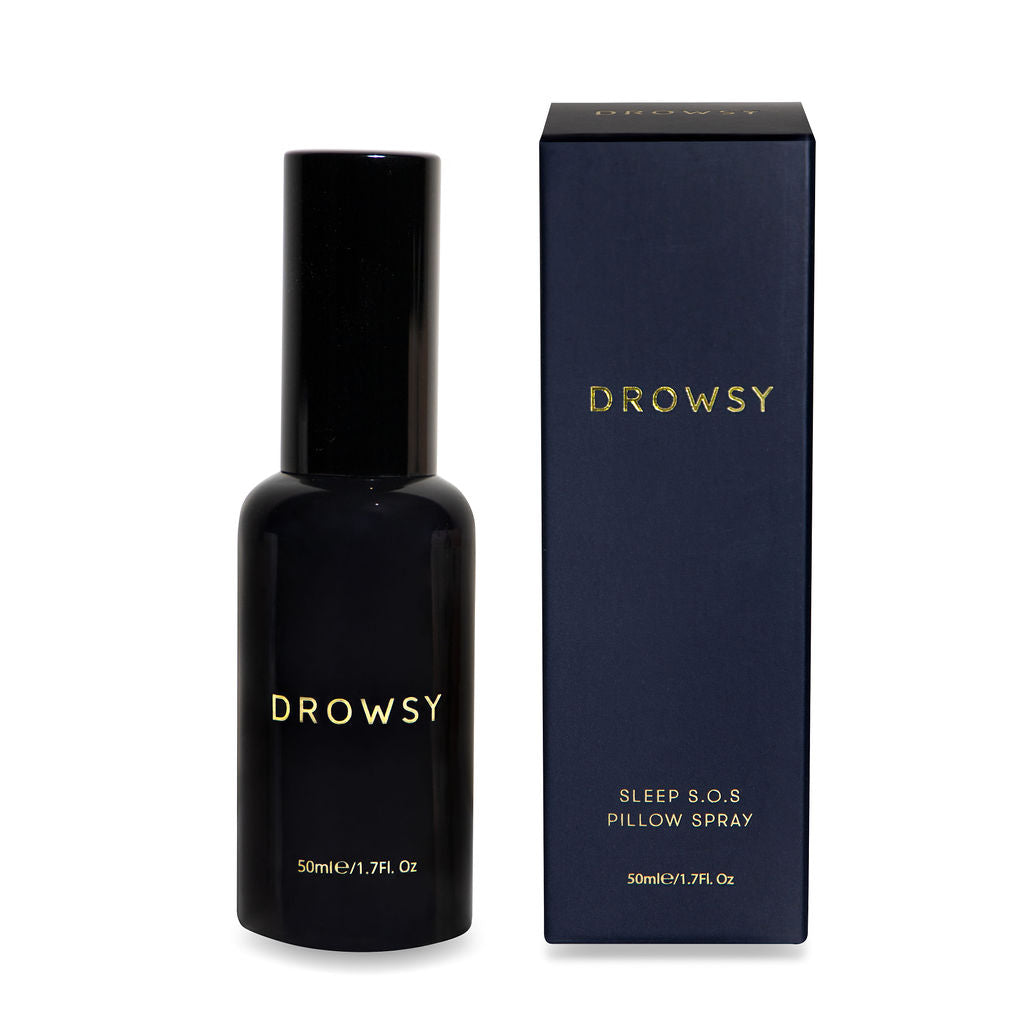 A dark bottle labeled drowsysleepco stands beside its matching box, both with gold lettering on midnight blue—pair the Midnight ritual bundle (Midnight Blue White Akoya Pearl) for a truly luxurious sleep experience.