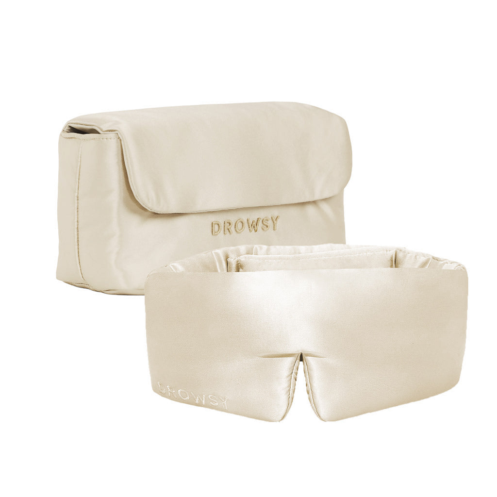 The Sleepover bundle - Dusty Gold includes a beige satin sleep mask and matching pouch, both labeled DROWSY. The padded silk mask offers comfort, while the flap-closure pouch keeps essentials handy for your nightly routine.
