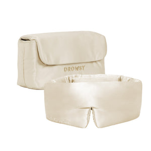 The Sleepover bundle - Dusty Gold includes a beige satin sleep mask and matching pouch, both labeled DROWSY. The padded silk mask offers comfort, while the flap-closure pouch keeps essentials handy for your nightly routine.