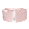 The Sunset Pink eye mask is a light pink, padded silk mask with DROWSY embroidered on the side and a nose notch—ideal for beauty sleep and reducing dark circles.