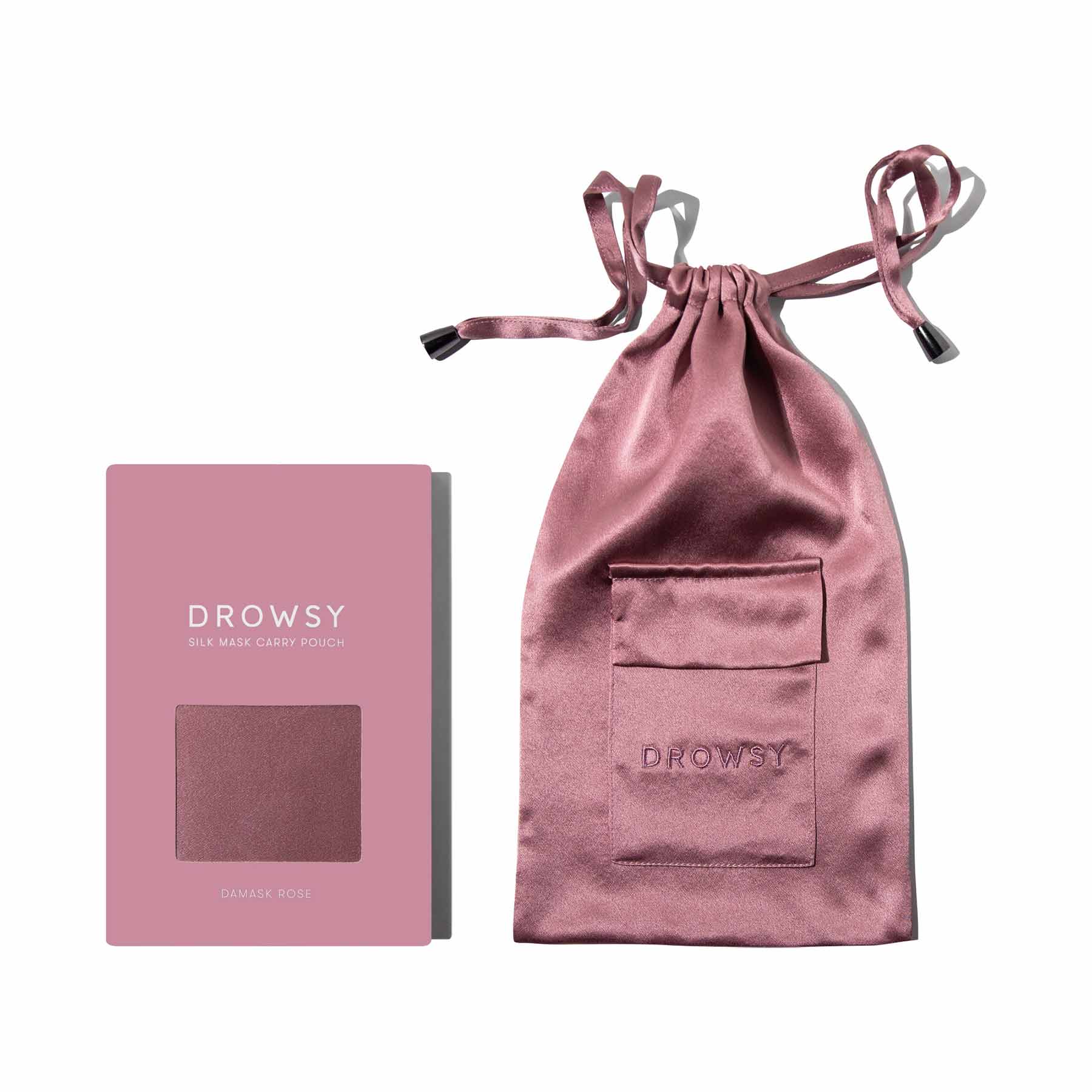 The Damask Rose Silk Carry Pouch, in pink mulberry silk, is shown with its matching box labeled Drowsy Silk Mask Carry Pouch, both elegantly presented on a white background.