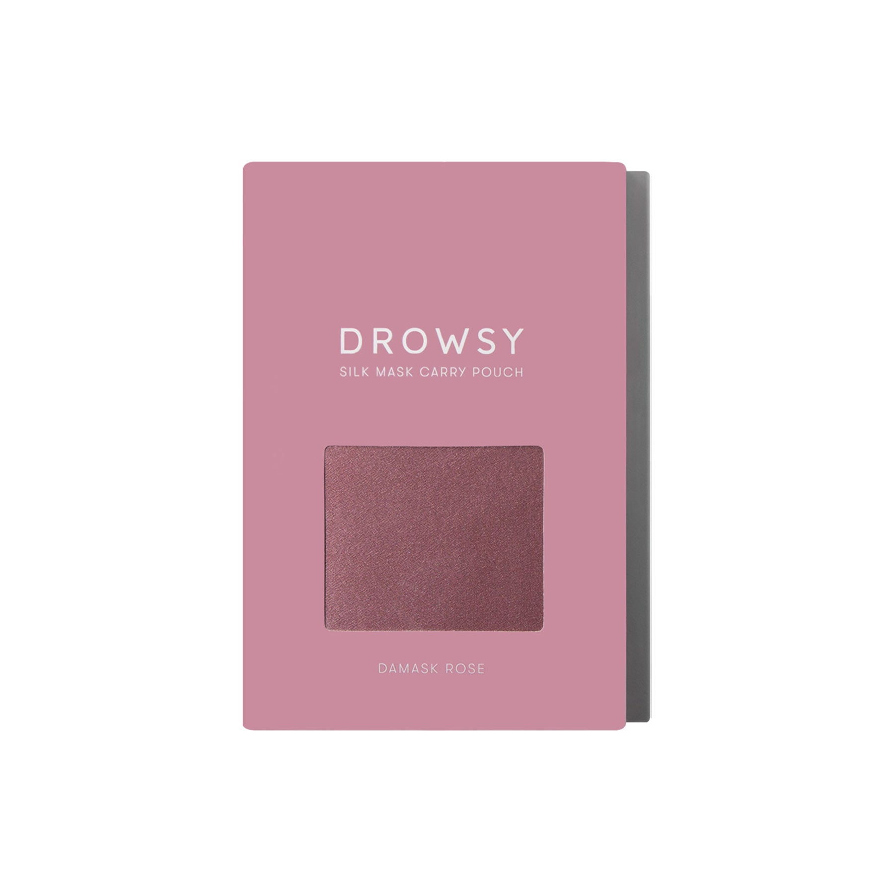 A pink rectangular box labeled Damask Rose Silk Carry Pouch has a window showing rose-colored mulberry silk inside, with DAMASK ROSE printed below the window.