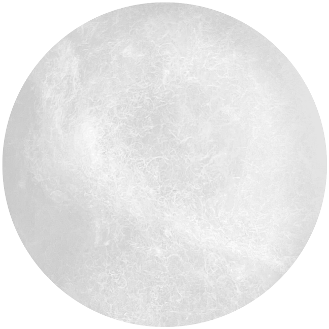 A close-up view of a round, white, fluffy cotton pad with a soft and fibrous texture against a plain white background.
