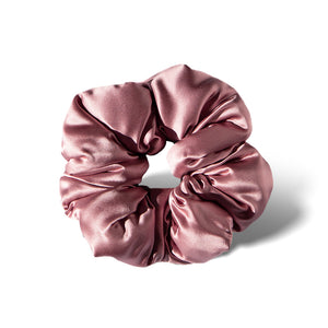 The Damask Rose - Padded Scrunchie is a shiny, pink oversized silk hair accessory with gathered, ruched fabric arranged in a circular shape, shown on a white background for a touch of luxury.