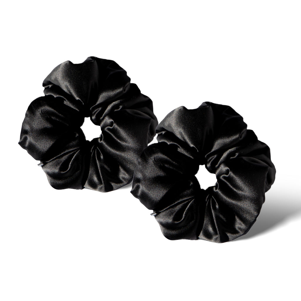 Two Black Jade - Padded Scrunchies are displayed on a white background, with one slightly overlapping the other—ideal as gentle hair sleep accessories.