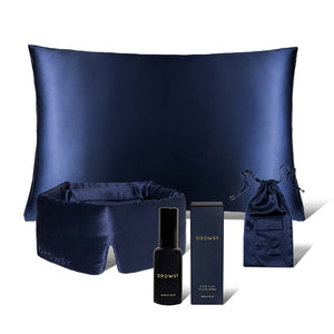 The drowsysleepco Midnight ritual bundle in Midnight Blue includes a pillowcase, sleep mask, spray bottle, pouch, and box, all beautifully displayed on a white background.