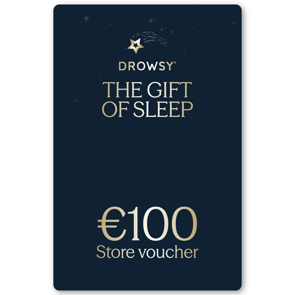 A dark blue Sleep Gift Card with gold text reads “The Gift of Sleep” and “€100 Store Voucher,” featuring a shooting star graphic at the top—the perfect treat for any online store purchase.