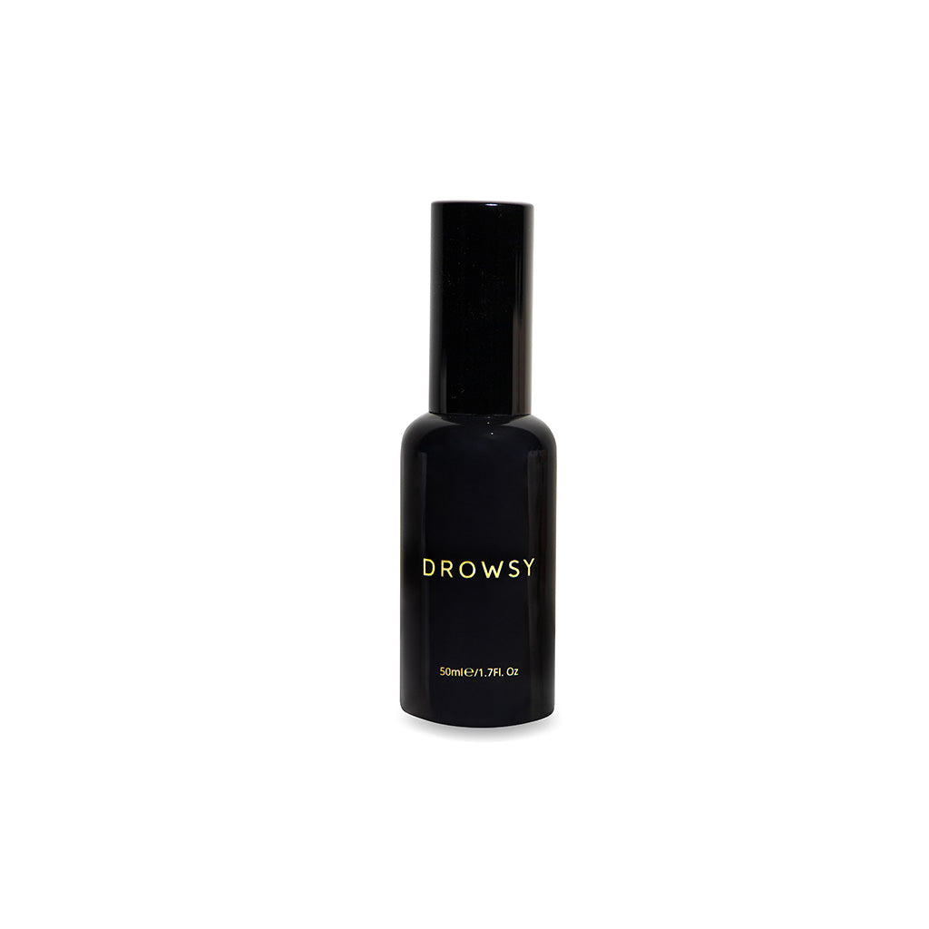 A sleek black bottle labeled Sleep S.O.S Pillow Spray in gold text, 50ml (1.7 fl oz), is centered on a white background—the perfect natural sleep aid to enhance your nightly ritual.