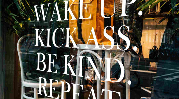 Motivational writing on glass. Wake up. kick ass. be kind. repeat