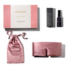 A pink Damask Rose - Deep Sleep Collection gift box with a luxury silk sleep mask, matching pink silk pouch, and a dark bottle of deep sleep pillow spray arranged neatly together.