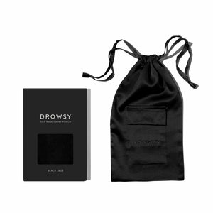 A Black Jade Silk Carry Pouch with a drawstring rests beside its black box, which features a small window showcasing the pouch’s luxurious mulberry silk fabric.