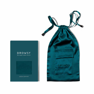 A Green Sapphire Silk Carry Pouch in rich teal mulberry silk with a drawstring and pocket sits beside its matching box, both sharing the same vibrant color and labeled Green Sapphire Silk Carry Pouch.