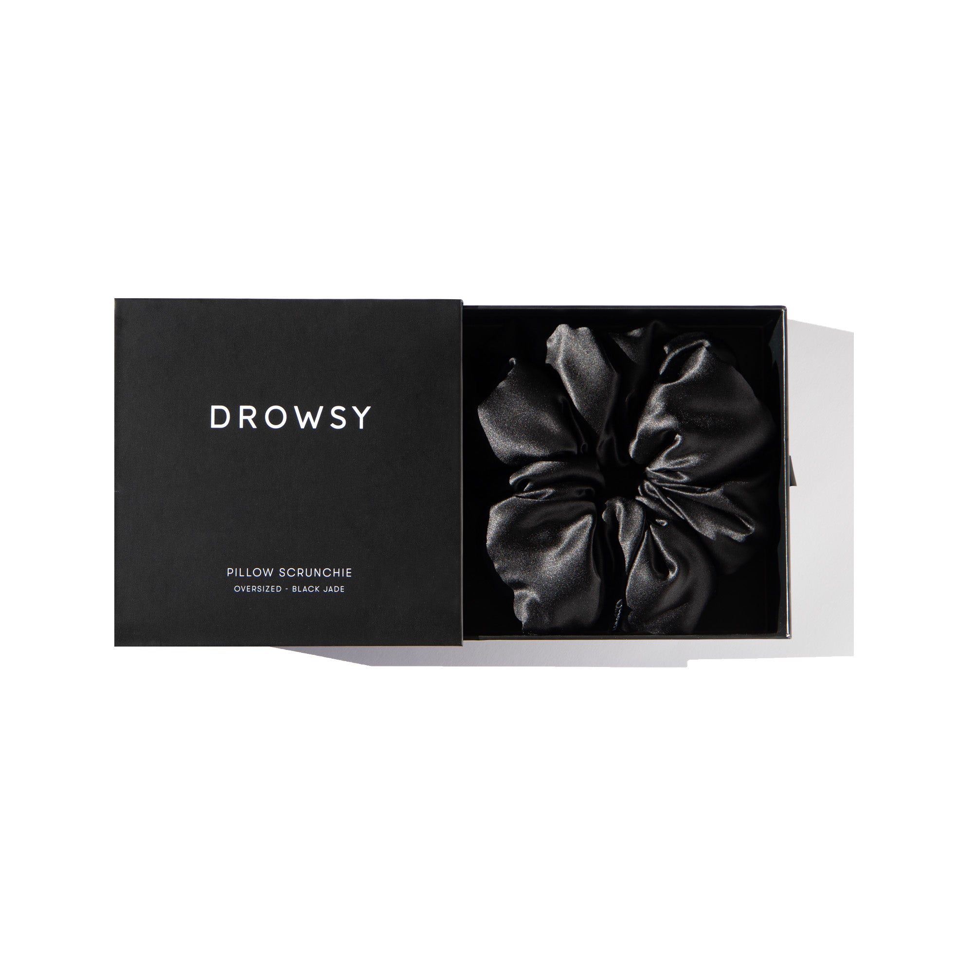 Drowsy Black Jade Pillow Scrunchie in its box on a white background