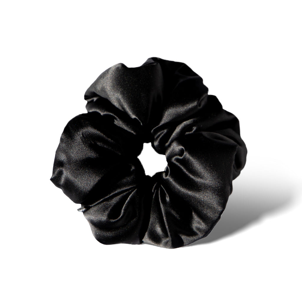 The Black Jade - Padded Scrunchie features a soft, shiny black satin design and is shown against a white background with a subtle shadow—ideal for supporting hair health and enhancing your style.