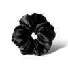 The Black Jade - Padded Scrunchie features a soft, shiny black satin design and is shown against a white background with a subtle shadow—ideal for supporting hair health and enhancing your style.