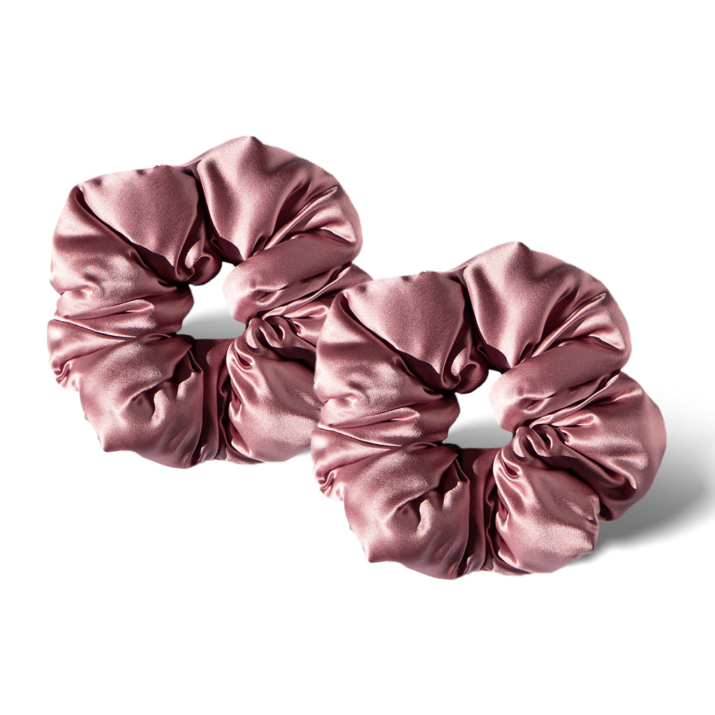 Two shiny, light mauve Damask Rose - Padded Scrunchies are placed side by side on a white background, casting soft shadows—perfect as gentle hair sleep accessories.
