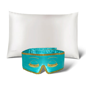 The Perfect Skin Bundle Breakfast at Drowsy by drowsysleepco showcases a white silk pillowcase and a turquoise sleep mask with gold embroidered eyelashes, set against a white background—ideal for elevating your beauty sleep.