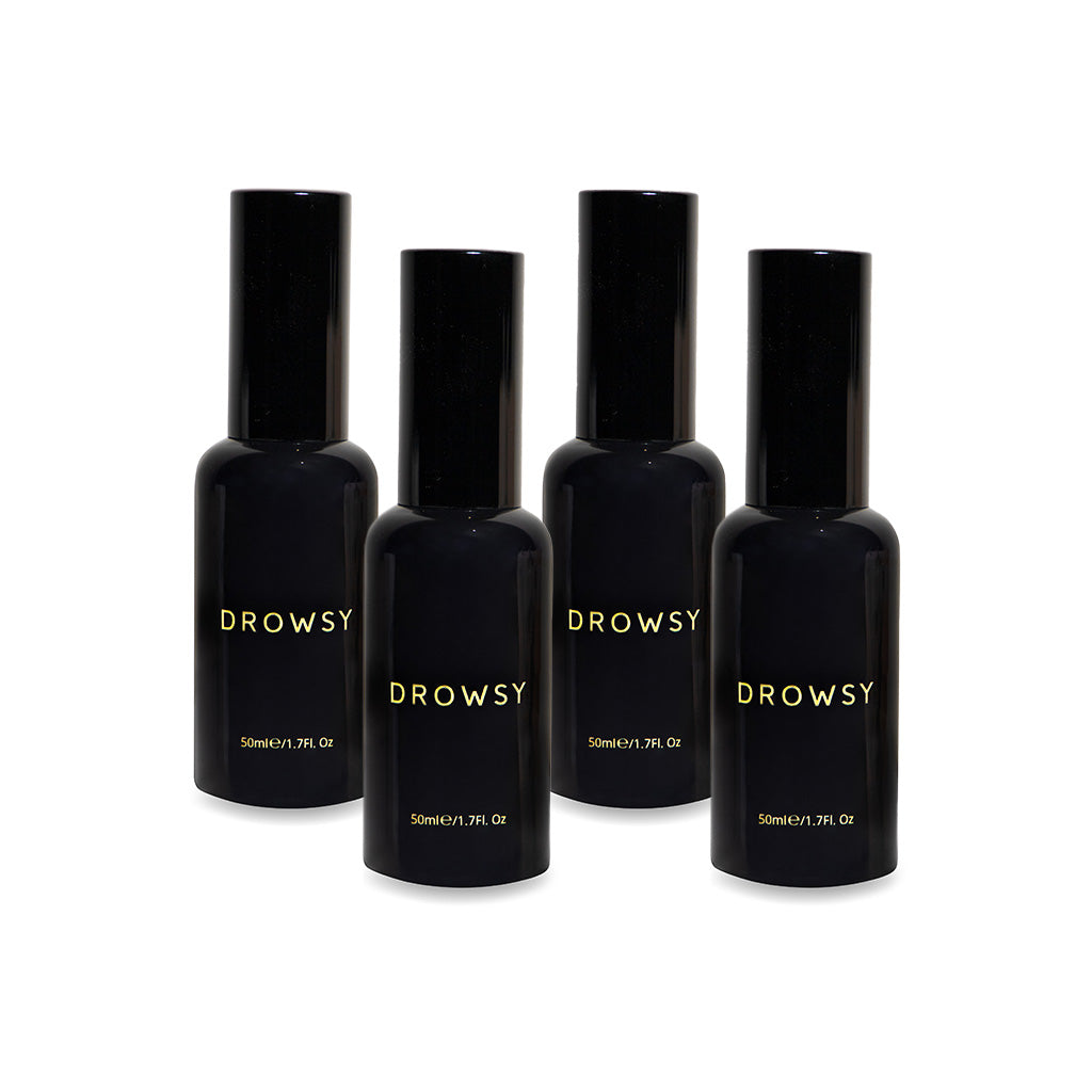 Four black bottles labeled Sleep S.O.S Pillow Spray with gold text stand upright in a row. Each 50ml (1.7 fl oz) bottle has a tall black cap—a natural sleep aid perfect for your night ritual, set against a white background.